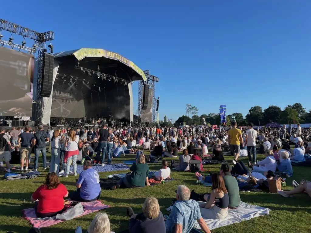 Festival event stage at Engelfield House, with crows in front of the stage watching the performance